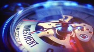 a close up of a watch face with a red second hand.