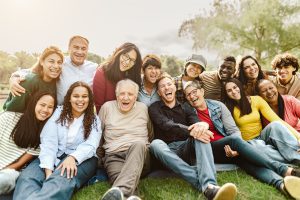 Grandparents in park with family.